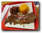 La Granja Grilled Steak and Onions with Yellow Rice and Plantains
